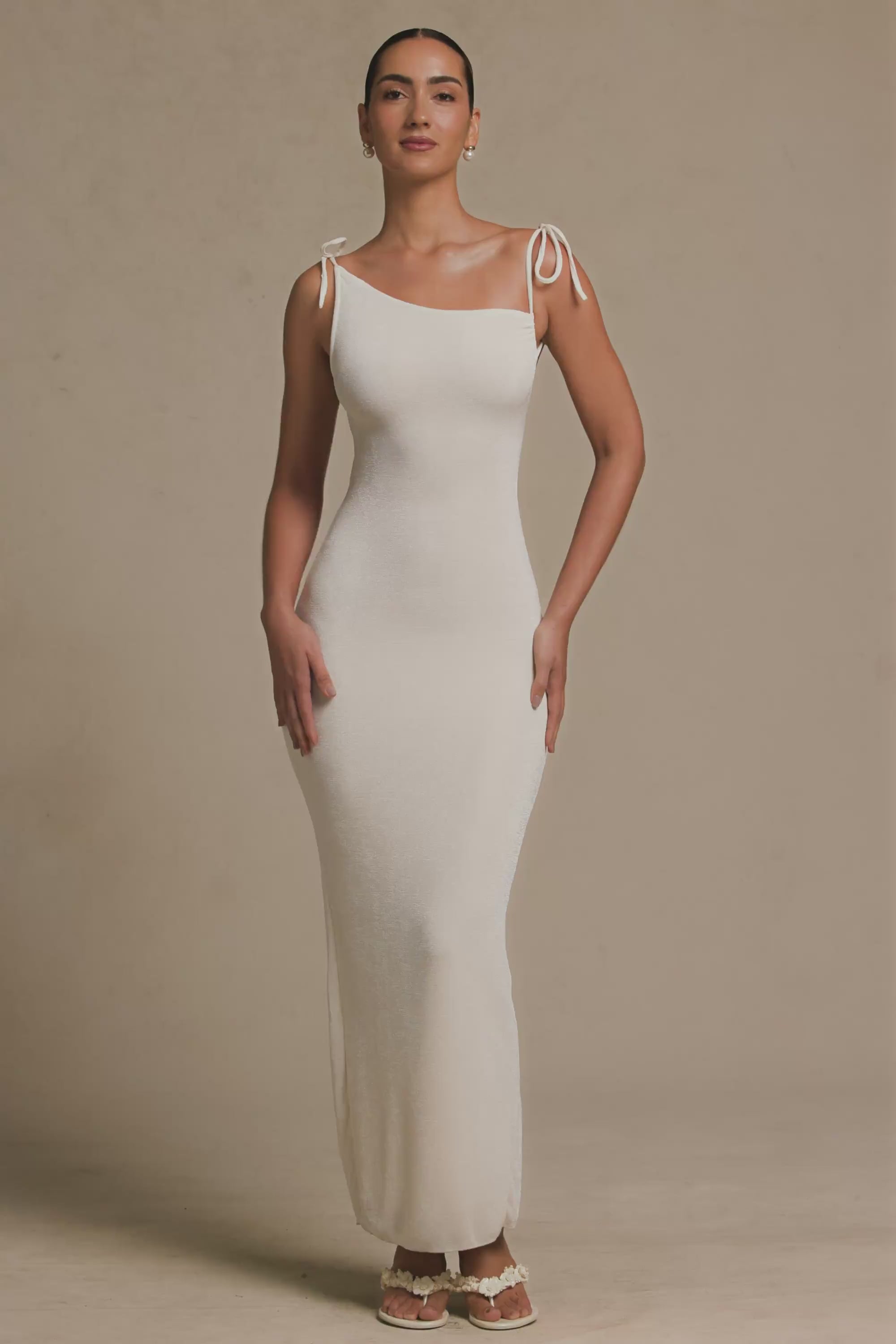 Load video: Textured Jersey Backless Maxi Dress in Ivory